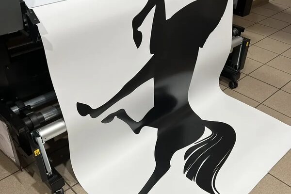Large-format print coming off the Roland wide-format printer in Murfreesboro