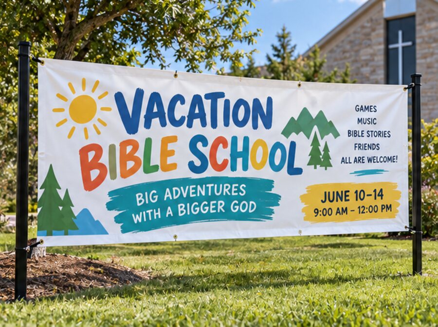 Vacation Bible School outdoor banner mounted on a frame in front of a church