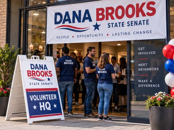 State senate campaign banner over a volunteer headquarters with an A-frame sign
